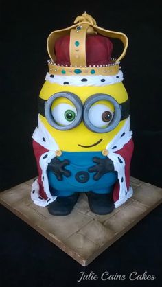 a cake made to look like a minion wearing a crown