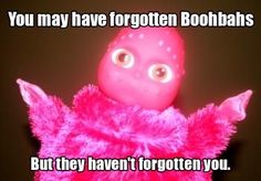 a pink stuffed animal with big eyes on it's chest and arms, sitting in front of a black background