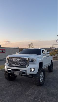 a white truck parked in a parking lot