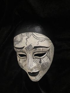 DO NOT FORGET TO WRITE DOWN YOUR PHONE NUMBER, IT IS NECESSARY FOR THE DELIVERY. Pierrot's Face Original Venetian Handmade mask Ideal For Halloween Party and decor. Pierrot's character is the sad clown, pining for the love of Columbine. Columbine often breaks the naive and idealistic Pierrot's heart. Unlike many characters in the Commedia dell'Arte, Pierrot has weathered the centuries well, followed and defended by artistic movements such as romanticism, symbolism, and even modernism. Our masks Art Deco Masks, Clown Masquerade Mask, Commedia Dell'arte Masks, Dark Clown Costume, Aesthetic Mask Design, Historical Masks, Clown Masks, Porcelain Mask, Abstract Mask