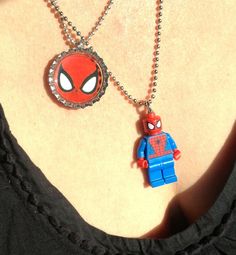 a woman wearing a necklace with a spiderman pendant