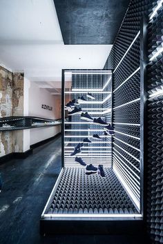 there are many pairs of shoes on display in the store's shoe storage area