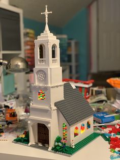 a lego model of a church with a clock on it