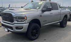 a large gray truck parked in a parking lot