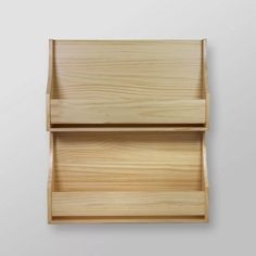 a wooden shelf with two compartments on it