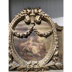 an ornate frame with a painting on it