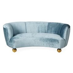 a blue couch sitting on top of a white floor