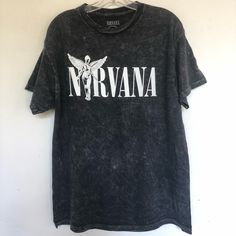 Nirvana In Utero Vintage Black Tee Shirt Faded Black T Shirt That Features Nirvanas Logo. Printed On A Washed Down Soft Garment - Mineral Washed Cotton In A Relaxed Fit. Vintage Logo Crew Neck Short Sleeves Brand New Officially Licensed Nirvana Vintage Black T Shirt Size Small Chest 18” Length 26” Size Medium Chest 20” Length 28” Size Large Chest 22” Length 29” Nirvana In Utero Vintage Black Graphic Tee Shirt Black Nirvana Shirt, Vintage Nirvana Shirt, Black Soft-washed Shirt For Summer, Alternative Washed Black Short Sleeve Tops, Black Soft-washed T-shirt For Concert, Oversized T-shirts, Graphic Tees Vintage Band Shirts, Alt Shirts, Nirvana Clothes