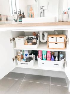 the bathroom cabinet is full of beauty products