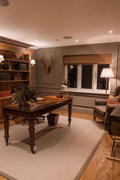 a living room filled with furniture and a book shelf