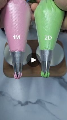 two different colored plastic cones are being used to make something with the same size and shape