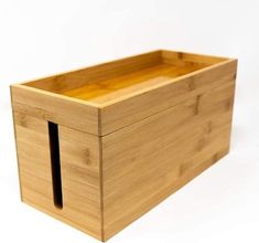 a wooden box with two compartments on the inside and one in the outside, sitting on a white surface