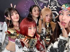 the girls are posing with their trophies