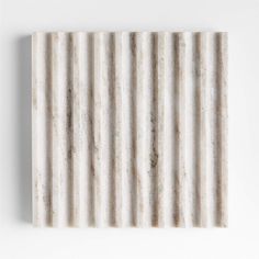 a white wall with vertical stripes on it