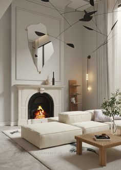 a living room with white furniture and a fire place