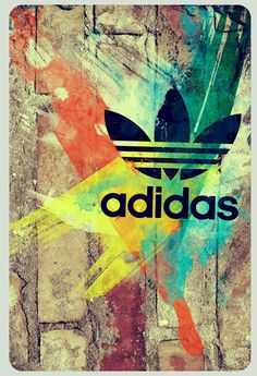 the adidas logo is painted on an old brick wall with multicolored paint