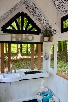 the inside of a small bathroom with a tub and sink under a roof that has leopard print on it