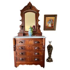 This Eastlake Victorian dresser, hailing from the early 1800s, is imbued with the refined aesthetic of its time. The dresser's burl wood veneer is indicative of its status as a piece belonging to a discerning middle to upper-middle class Victorian home. It is characterized by its functionality and the ornate craftsmanship of the era, evident in the hand-made dovetail joints and smoothly functioning drawers. -Hand-crafted dovetail joints on drawer fronts and backs, showcasing the high-quality cra Victorian Dresser, Eastlake Dresser, Antique Dresser With Mirror, Marble Top Dresser, Victorian Apartment, Victorian Dressers, Wood Furniture Plans, Modern Victorian, Victorian Furniture