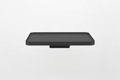 a black rectangular object on a white background