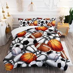 a bed room with a basketball and soccer balls on the comforter set, next to a night stand