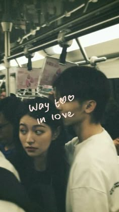 two people standing next to each other on a train with the words way we love in love