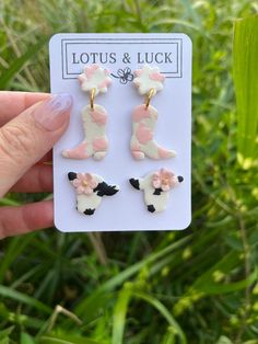 Pink cow print booties and the cutest little cow head studs to match!!  Each piece is handmade and one of a kind, so slight variations may occur, but will not affect the functionality or appearance. Made with hypoallergenic posts for sensitive ears. Interested in a custom order or style variations? I would love to work with you to create your perfect pair of earrings. Feel free to message me for any questions or concerns! Follow me on instagram and facebook for sneak peeks and new launches! @lot Strawberry Milk Cow, Pink Cow Print, Cow Earrings, Handmade Clay Jewelry, Cow Head, Pink Cow, Milk Cow, Strawberry Milk, Statement Earring