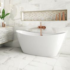 a white bath tub sitting on top of a bathroom floor