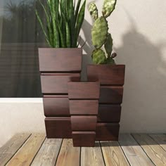 a tall wooden planter sitting on top of a wooden floor next to a cactus