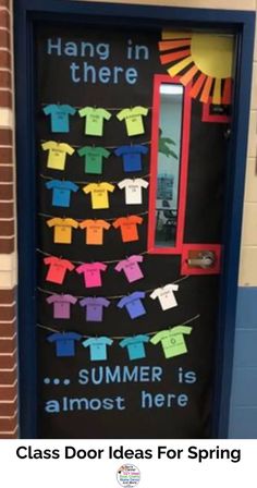 a classroom door decorated with colorful clothes and the words hang in there summer is almost here