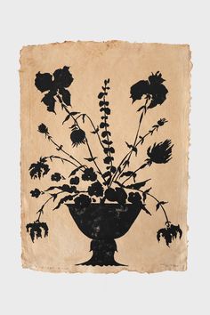 a black and white drawing of flowers in a vase on a piece of parchment paper