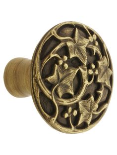 an antique brass door knob with decorative design