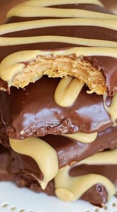 chocolate and peanut butter candy bars stacked on top of each other