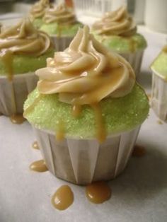 cupcakes with frosting and caramel drizzled on the top