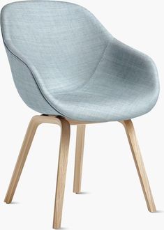 a light blue chair with wooden legs