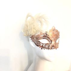 This filigree laser cut mask painted, embellished with Rhinestones and adorned with ivory feathers. S H I P P I N G - Processed same day or within 24 hours. 1-2 day guaranteed delivery, add item to cart, click shipping tab for rates. Pls leave a check out note with your need date & contact number Msg for delivery time frames (Include your state/country) S I Z E Measures approx. 9 inches in length, 4 inches in Width from forehead to nose. Detailed dimensions available upon request. C U S T O Elegant Feathered Masquerade Mask For Mardi Gras, Elegant Feathered Masquerade Mask, Elegant Feathered Eye Mask For Masquerade, Masquerade Carnival Headpiece, Elegant Wedding Masks, Elegant Feathered Masquerade Mask For Costume Party, Elegant Carnival Headpieces As Gifts, Elegant Headpieces For Carnival Gift, Elegant Mardi Gras Masks And Prosthetics