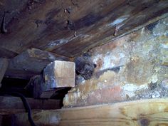 the inside of an old building with exposed wood