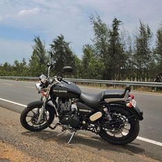 a motorcycle is parked on the side of the road