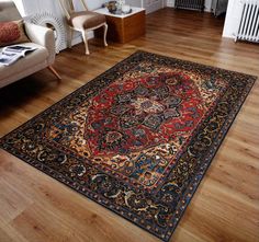 a living room with hardwood floors and a rug on the floor