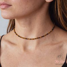 This tiger eye dainty choker is fun and easy to wear and match with any outfit. They can express your style, mood, or personality in a subtle and charming way. It is perfect for anyone who loves minimalist style, natural stones. It is a unique and meaningful gift for yourself or someone special. You can wear it by itself or mix it with other necklaces for a fun and trendy look. If you have a large demand of the stone beads or necklace, please feel free to contact us for details. - Material : abo Dainty Choker, Stone Beaded Necklace, Crystal Choker, Tiger Eye Stone, Dainty Jewelry, Necklace Sizes, Birthstone Necklace, Tiger Eye, Stone Necklace