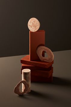 an object is sitting on a table next to a cup