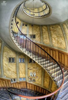 a spiral staircase in an old building