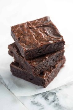 three chocolate brownies stacked on top of each other