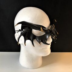 DESCRIPTIONMystify the mortals at the Halloween masquerade with a gold-tipped, black leather vampire mask! Perfect for masquerade parties or theatre productions. Get this gold-tipped mask for Halloween or Vampire Masquerade. A sexy costume accessory for your vampire costume, and a fantastic festival mask! Add to a RenFaire costume. Any color. Waterproofed leather, glossy or matte finish, & several choices to affix the mask (cord, elastic, ribbon, waterproof cord, stick, or no holes for adhesive) Leather Vampire, Renfaire Costume, Mask Cord, Vampire Mask, Festival Mask, Black Masquerade, Black Masquerade Mask, Mask For Halloween, Ren Faire Costume