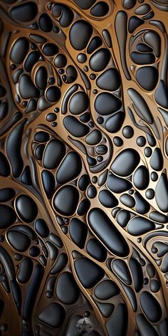 an abstract pattern made up of black and gold shapes with water droplets on the surface