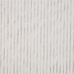 a white textured wall with vertical lines