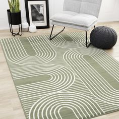 a modern rug with an abstract design in green and white, on a wooden floor