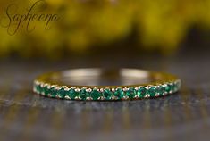 Dainty Green Emerald Half Eternity Wedding Wedding Band,Yellow Gold Emerald Band,May Birthstone Ring,Stacking Gemstone Ring by Sapheena Our dainty half eternity band is set with round cut green emerald gemstones and made in solid 14k yellow gold. Also available in 14k/18k rose, white or yellow gold or platinum.                                     Emerald is the May birthstone, a symbol of rebirth and love. ** Band Description: * Metal: solid 14k/18k rose, white or yellow gold or platinum * Shape Green Gemstone Eternity Band For Wedding, Green Round Cut Wedding Eternity Band, Green Round Cut Eternity Band For Wedding, Emerald Eternity Band For Wedding, Elegant Emerald Eternity Band For Wedding, Emerald Round Cut Eternity Band For Wedding, Wedding Emerald Round Cut Eternity Band, Emerald Half Eternity Wedding Band, Yellow Prong-set Jewelry For Wedding