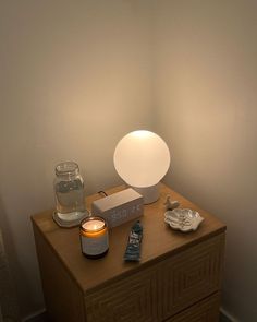 a table with a lamp and some items on it