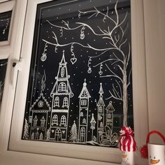 the window is decorated with christmas decorations