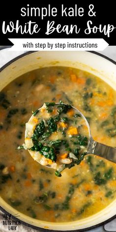 a ladle full of white bean soup with spinach and carrots in it